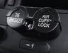 Air cuff lock device labeled 'The Enforcer' on a car dashboard.