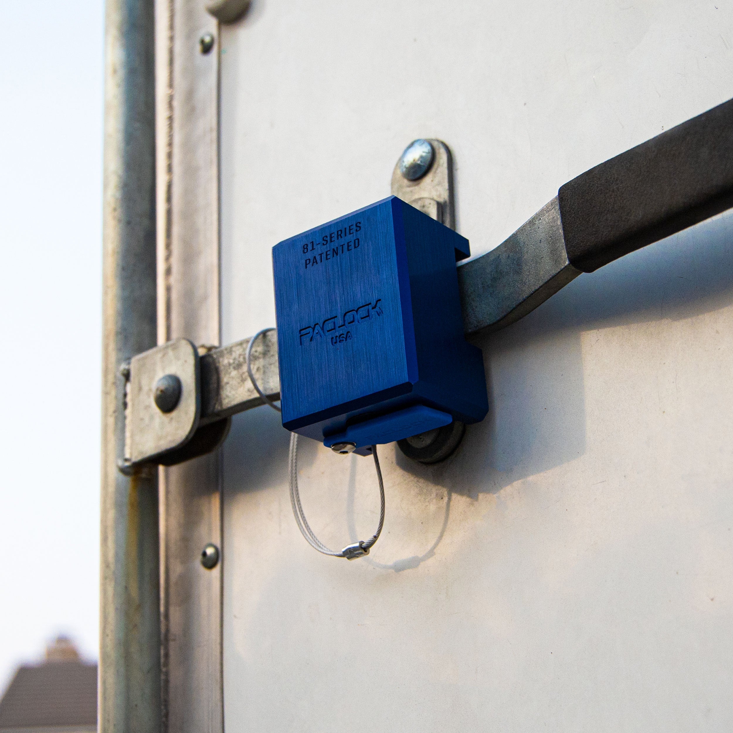 Blue security lock attached to a metal door