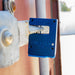 Blue padlock attached to a metal door with blurred background